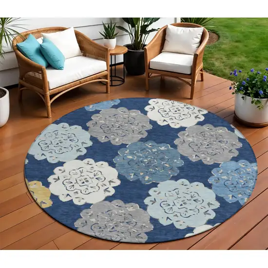 8' Navy Blue Ivory And Gold Round Quatrefoil Washable Indoor Outdoor Area Rug Photo 1