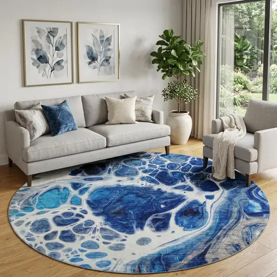 8' Navy Blue Ivory And Gray Abstract Washable Round Rug With UV Protection Photo 1