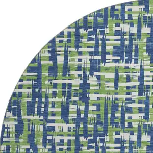 Photo of 8' Navy Blue Ivory And Green Abstract Geometric Washable Round Rug With UV Protection