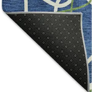 Photo of 8' Navy Blue Ivory And Green Geometric Washable Round Rug With UV Protection