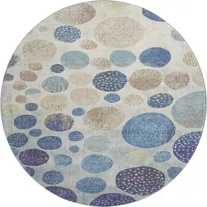 Photo of 8' Navy Blue Ivory And Taupe Geometric Washable Round Rug With UV Protection