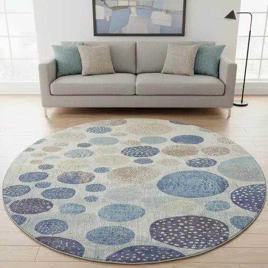 8' Navy Blue Ivory And Taupe Geometric Washable Round Rug With UV Protection Photo 2