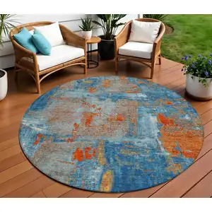 Photo of 8' Navy Blue Orange And Ivory Round Abstract Washable Indoor Outdoor Area Rug