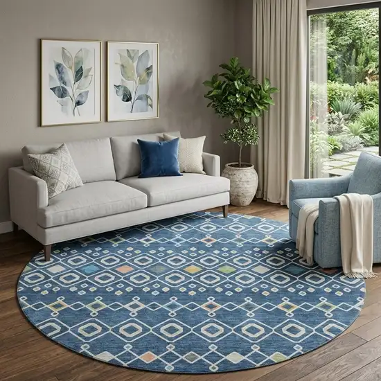 8' Navy Blue Peach And Gold Southwestern Washable Round Rug With UV Protection Photo 1