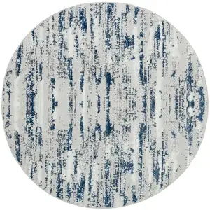 Photo of 4' Navy Blue Round Abstract Washable Non Skid Area Rug With Fringe
