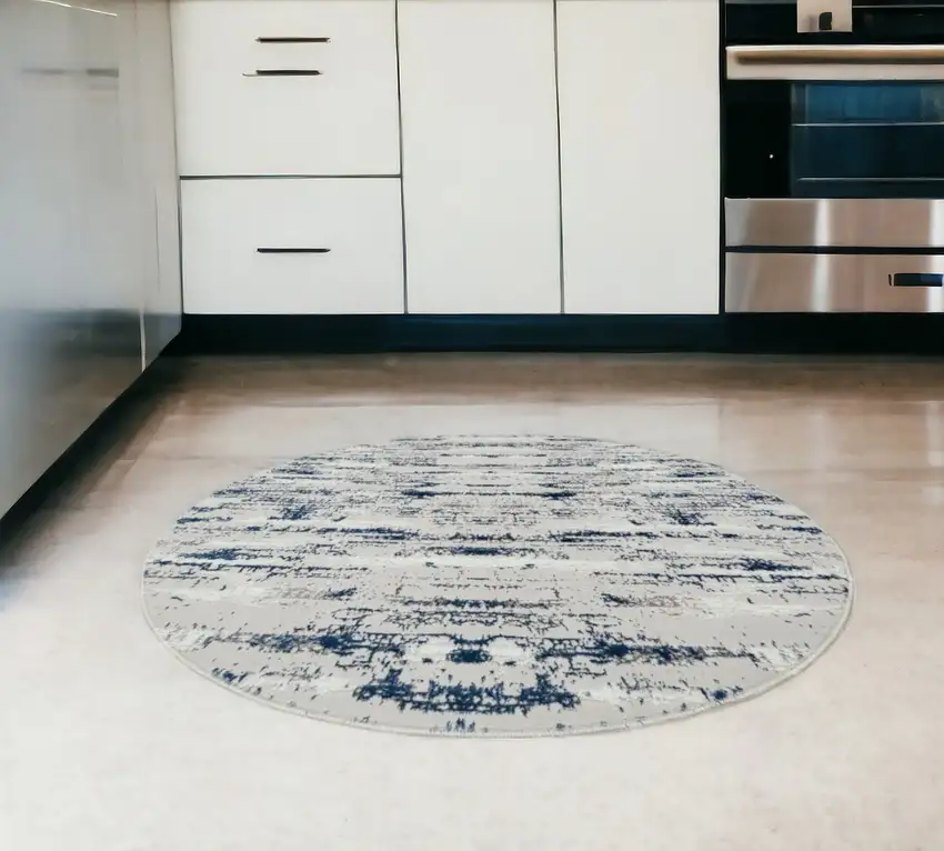 4' Navy Blue Round Abstract Washable Non Skid Area Rug With Fringe Photo 1