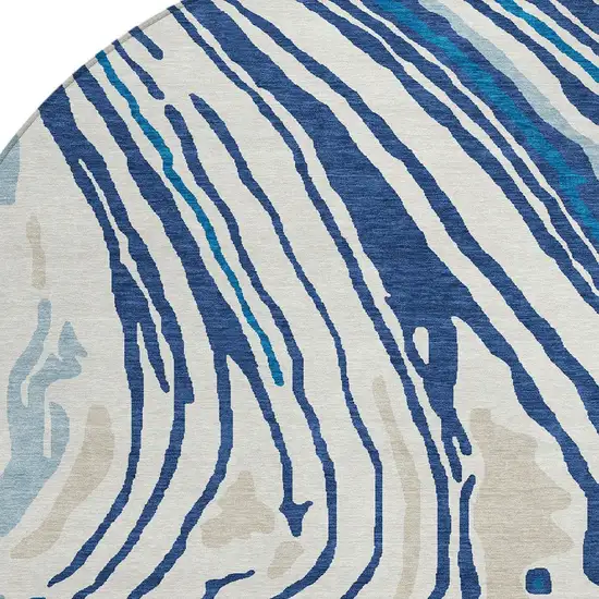 8' Navy Blue Teal Blue And Ivory Round Abstract Washable Indoor Outdoor Area Rug Photo 6