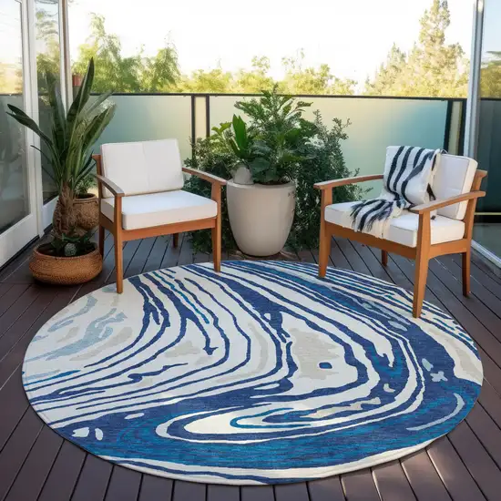8' Navy Blue Teal Blue And Ivory Round Abstract Washable Indoor Outdoor Area Rug Photo 8