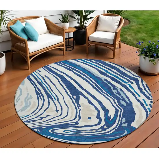 8' Navy Blue Teal Blue And Ivory Round Abstract Washable Indoor Outdoor Area Rug Photo 1