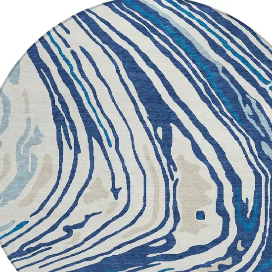 8' Navy Blue Teal Blue And Ivory Round Abstract Washable Indoor Outdoor Area Rug Photo 7