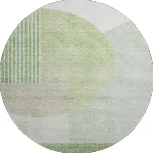 Photo of 8' Olive Green And Beige Geometric Washable Round Rug With UV Protection