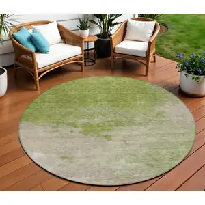 Photo of 8' Olive Green And Beige Round Abstract Washable Indoor Outdoor Area Rug