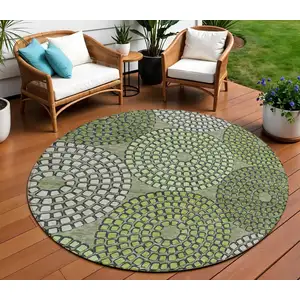 Photo of 8' Olive Green And Beige Round Geometric Washable Indoor Outdoor Area Rug