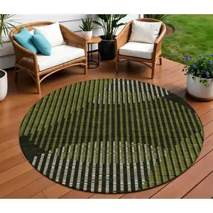 Photo of 8' Olive Green And Black Round Geometric Washable Indoor Outdoor Area Rug
