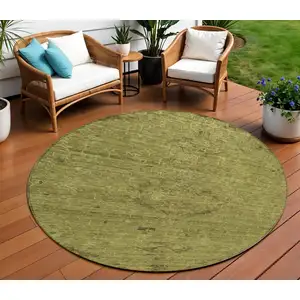Photo of 8' Olive Green And Brown Round Floral Washable Indoor Outdoor Area Rug