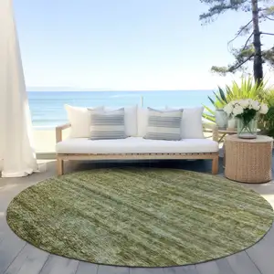 Photo of 8' Olive Green And Brown Round Striped Washable Indoor Outdoor Area Rug