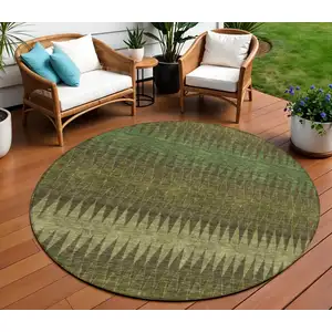 Photo of 8' Olive Green And Dark Green Round Striped Washable Indoor Outdoor Area Rug