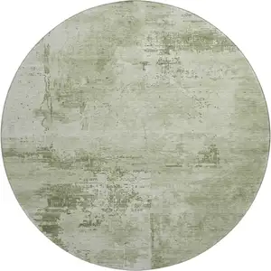 Photo of 8' Olive Green And Fern Green Abstract Washable Round Rug With UV Protection