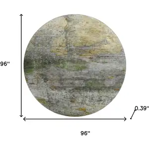 Photo of 8' Olive Green And Gold Abstract Washable Round Rug With UV Protection