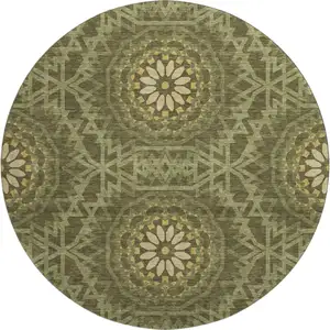 Photo of 8' Olive Green And Gold Geometric Washable Round Rug With UV Protection
