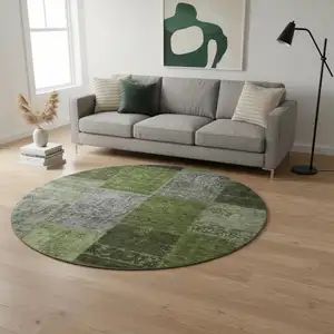 Photo of 8' Olive Green And Gray Patchwork Washable Round Rug With UV Protection