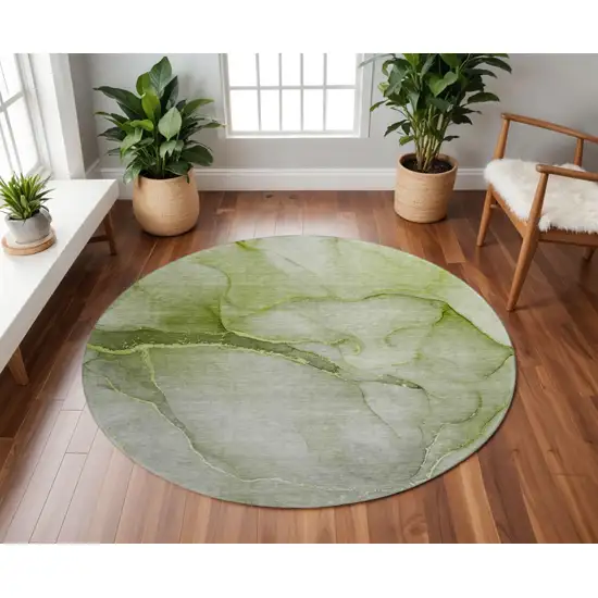 8' Olive Green And Ivory Abstract Washable Round Rug With UV Protection Photo 2