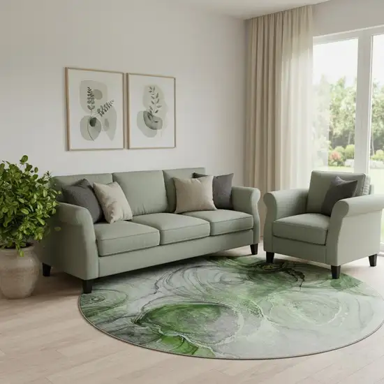 8' Olive Green And Ivory Abstract Washable Round Rug With UV Protection Photo 1
