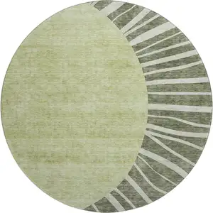 Photo of 8' Olive Green And Ivory Abstract Washable Round Rug With UV Protection