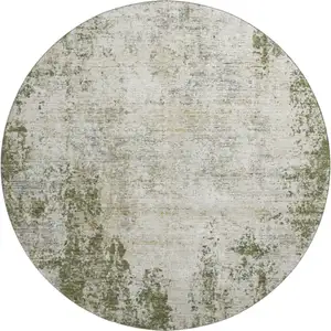 Photo of 8' Olive Green And Ivory Abstract Washable Round Rug With UV Protection