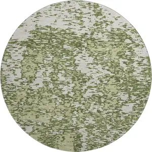 Photo of 8' Olive Green And Ivory Abstract Washable Round Rug With UV Protection