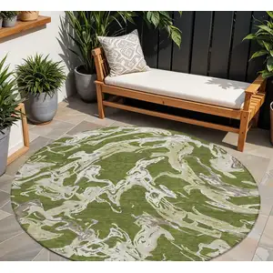 Photo of 8' Olive Green And Ivory Round Abstract Washable Indoor Outdoor Area Rug