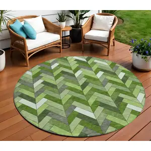 Photo of 8' Olive Green And Ivory Round Geometric Washable Indoor Outdoor Area Rug