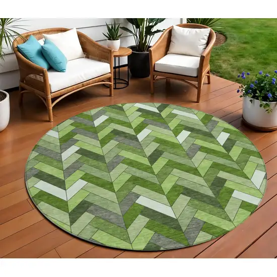 8' Olive Green And Ivory Round Geometric Washable Indoor Outdoor Area Rug Photo 1