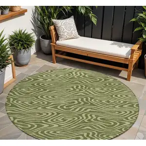 Photo of 8' Olive Green And Light Green Round Abstract Washable Indoor Outdoor Area Rug