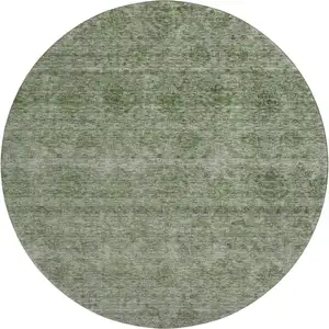 Photo of 8' Olive Green And Silver Abstract Washable Round Rug With UV Protection