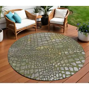 Photo of 8' Olive Green Brown And Gold Round Abstract Washable Indoor Outdoor Area Rug