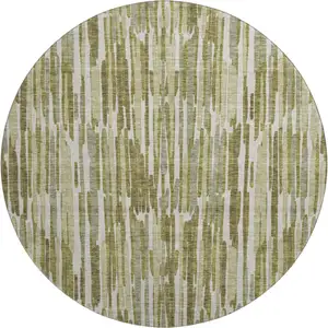 Photo of 8' Olive Green Brown And Ivory Abstract Washable Round Rug With UV Protection