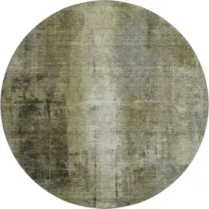 Photo of 8' Olive Green Charcoal And Ivory Abstract Washable Round Rug With UV Protection