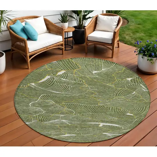 8' Olive Green Gold And Ivory Round Abstract Washable Indoor Outdoor Area Rug Photo 1