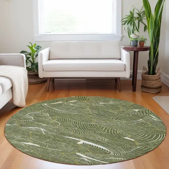 8' Olive Green Gold And Ivory Round Abstract Washable Indoor Outdoor Area Rug Photo 9