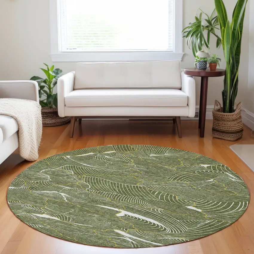 8' Olive Green Gold And Ivory Round Abstract Washable Indoor Outdoor Area Rug Photo 9