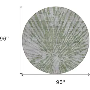 Photo of 8' Olive Green Gray And Silver Round Abstract Washable Indoor Outdoor Area Rug