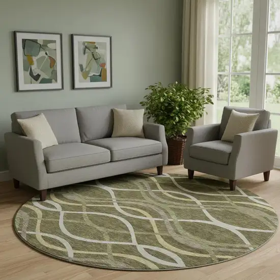 8' Olive Green Ivory And Gold Abstract Washable Round Rug With UV Protection Photo 1