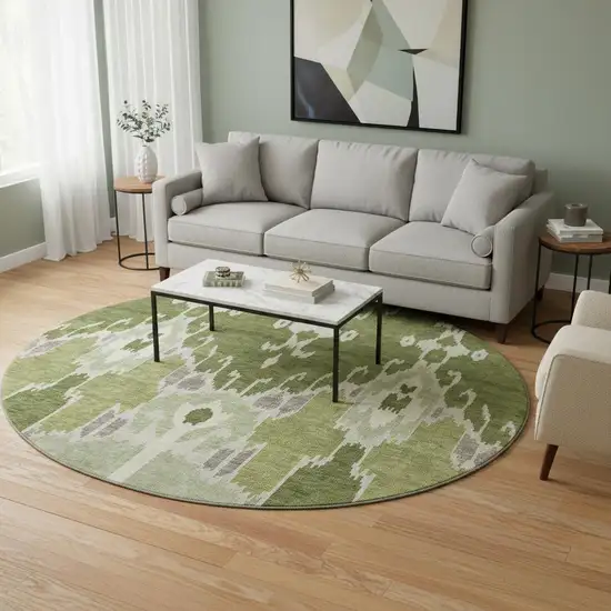8' Olive Green Ivory And Gray Ikat Washable Round Rug With UV Protection Photo 2