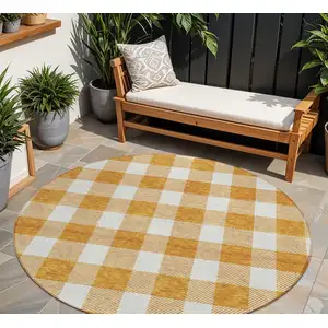 Photo of 8' Orange And Beige Round Plaid Washable Indoor Outdoor Area Rug