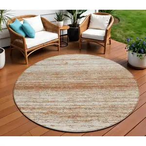 Photo of 8' Orange And Beige Round Striped Washable Indoor Outdoor Area Rug