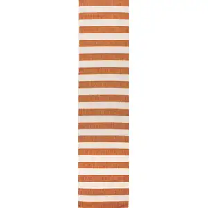 Photo of 8' Orange And Beige Striped Indoor Outdoor Runner Rug