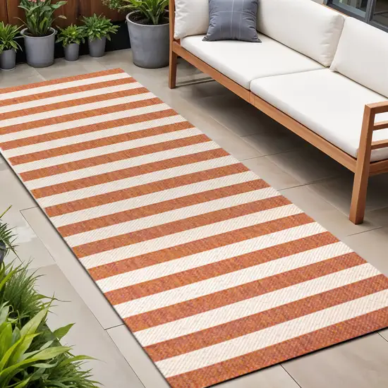 8' Orange And Beige Striped Indoor Outdoor Runner Rug Photo 1