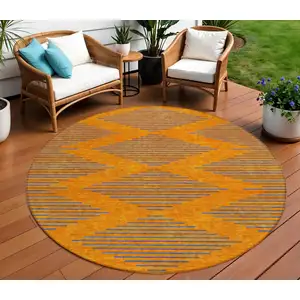 Photo of 8' Orange And Blue Round Geometric Washable Indoor Outdoor Area Rug