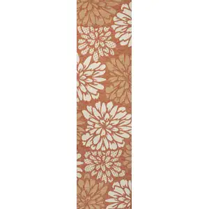 Photo of 10' Orange And Cream Floral Indoor Outdoor Runner Rug